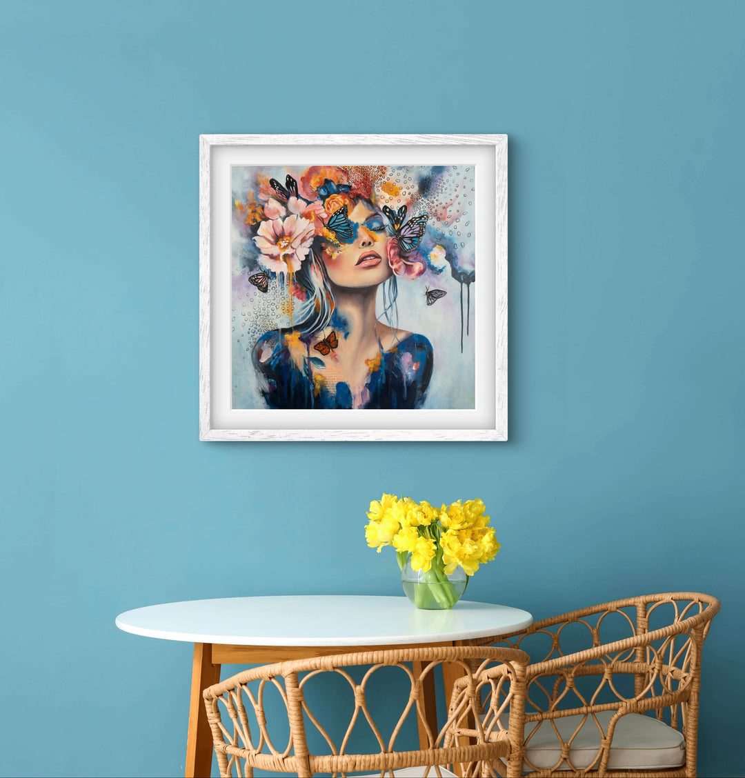 The 'Butterfly Dreams' art print by Tash Bardot hung in a serene dining setting. A dreamlike, expressive painting that brings a quiet rebellion and visual relief to modern spaces.