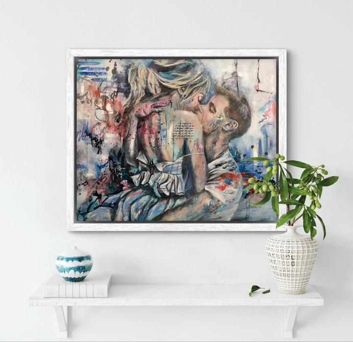 Dynamic couple painting 'Kiss of Promise' by Tash Bardot hung in a modern, light-filled living space. The abstract urban romance piece serves as a grounding visual anchor in the contemporary space.