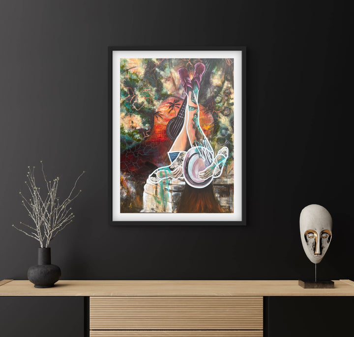 Vibrant, playful fine art print 'Melodies of Life' by Tash Bardot hung in a dark walled, minimalistic living area, serving as a joyful visual anchor.