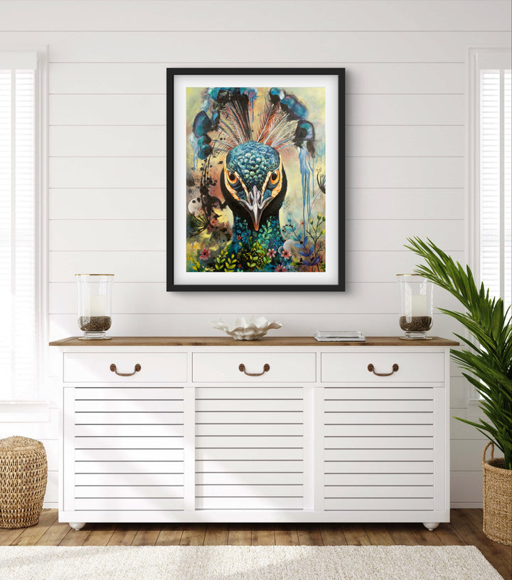 Commanding peacock portrait 'Regal Resolve' by Tash Bardot displayed in a light and summery living space. The direct-gaze fine art print provides an authoritative focal point and immediate visual relief.