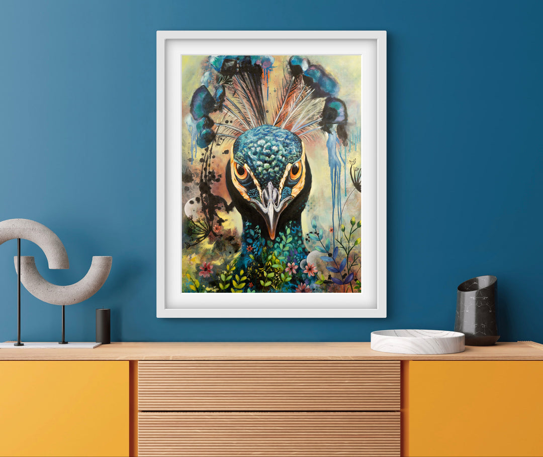 Commanding peacock portrait 'Regal Resolve' by Tash Bardot displayed in a bright and colourful living space. The direct-gaze fine art print provides an authoritative focal point and immediate visual relief.