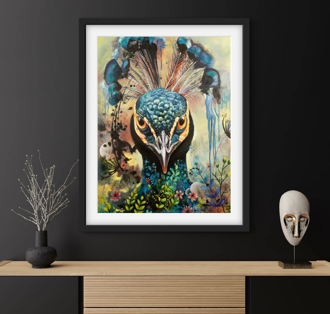 Commanding peacock portrait 'Regal Resolve' by Tash Bardot displayed above a contemporary sideboard on a striking black wall. The direct-gaze fine art print provides an authoritative focal point and immediate visual relief.