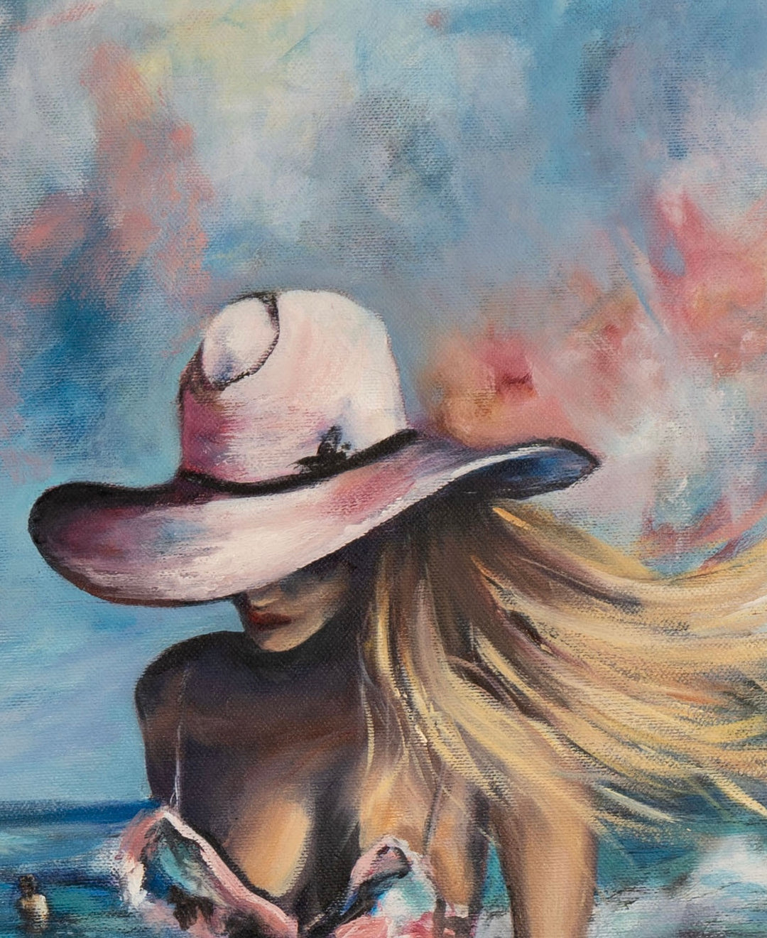 Close-up detail of 'Sacred Shores' by Tash Bardot, focusing on the woman's white wide-brimmed sun hat, blowing blonde hair, and profile against a vibrant, textured beach landscape.