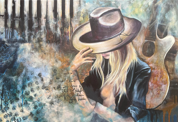 Tash Bardot's 'Soundtrack of Escape' painting. A woman tipping a brown hat over her eyes, surrounded by abstract piano keys, a guitar silhouette, and textured blue and amber brushwork.