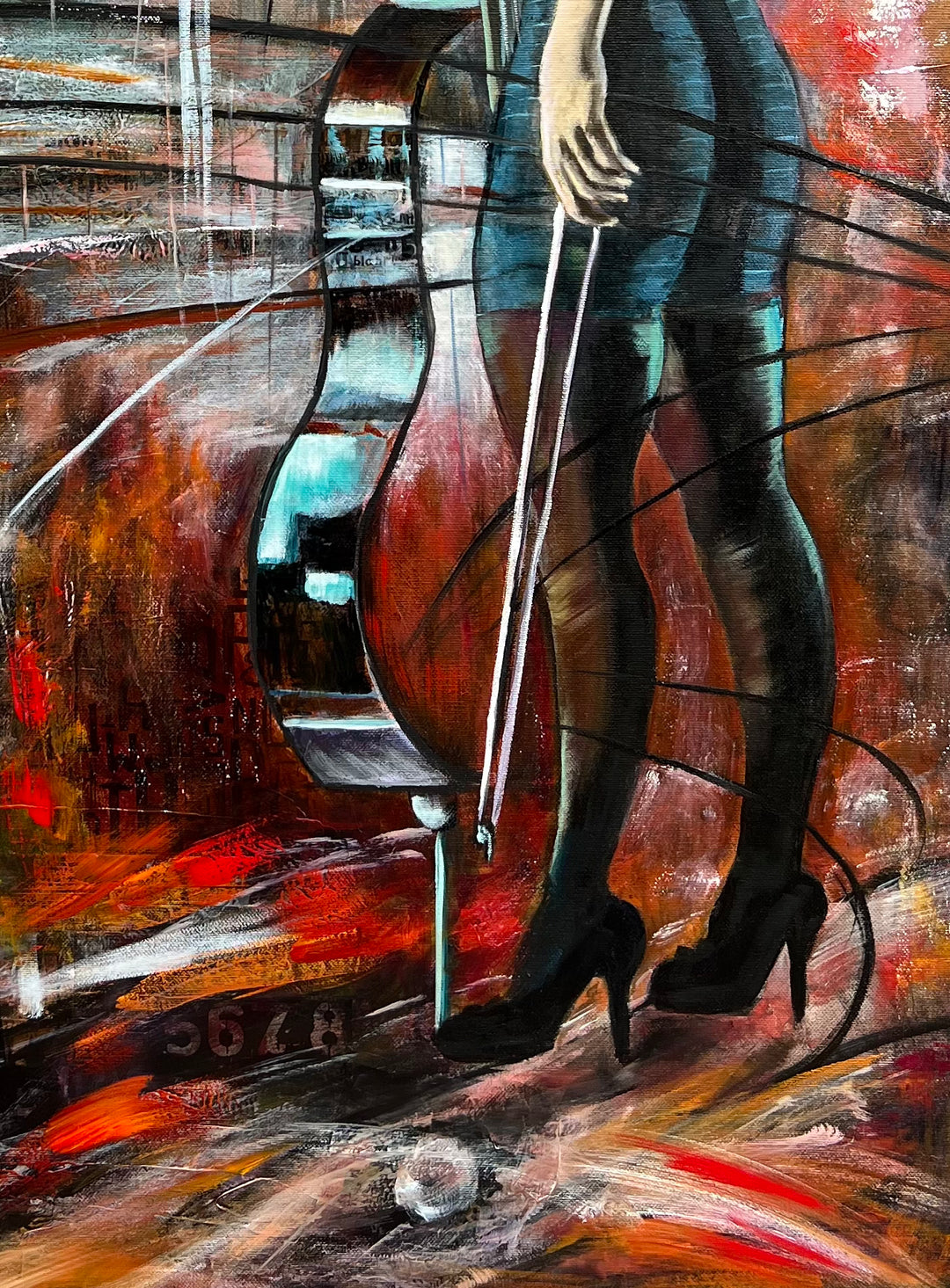 Close-up detail of 'The Sound of Strength' by Tash Bardot, highlighting the woman's powerful stance alongside a colourful and expressive cello. 
