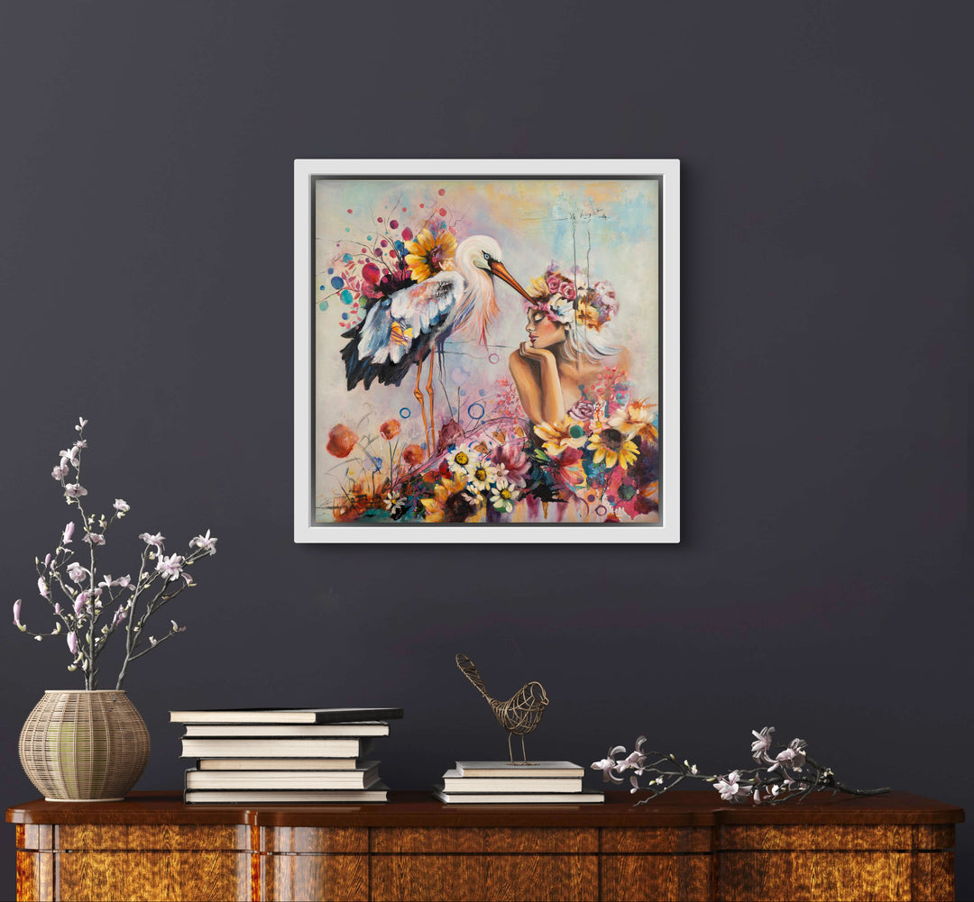 Expressive floral portrait wall art 'The Stork and I' by Tash Bardot displayed in a calming room interior. A vibrant, joyful painting offering visual relief and a private sanctuary for connection.